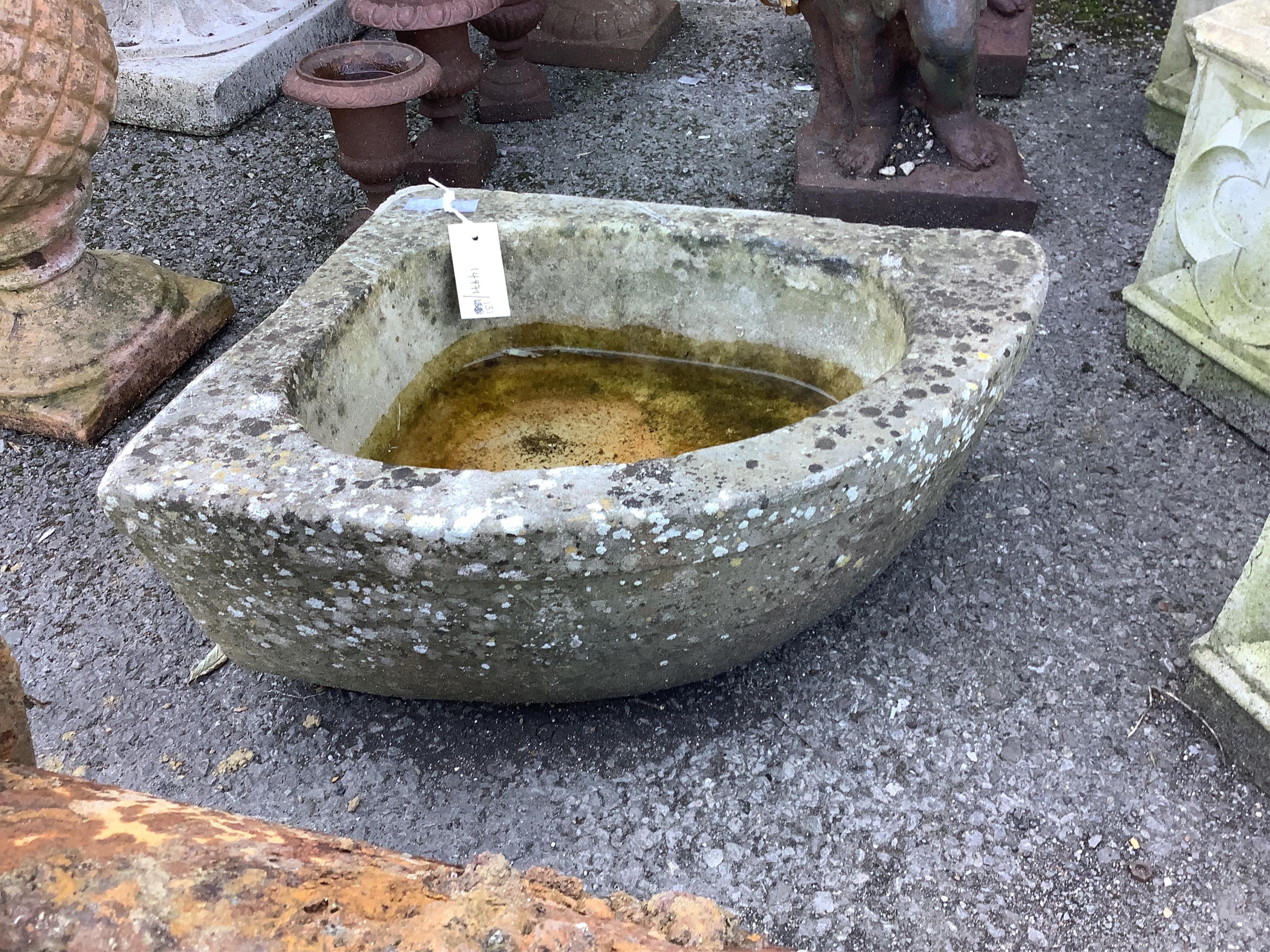 A granite corner trough, width 47cm, depth 40cm, height 19cm. Condition - fair